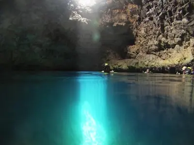 a person in a boat in a body of water at Casa Bahia 4 in Santa Maria