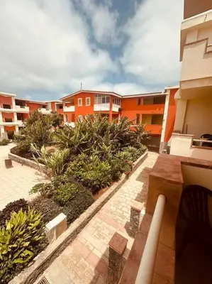 a balcony of a building with plants and buildings at appartement by seb in Santa Maria