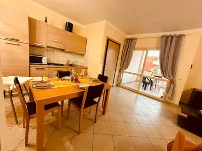 a kitchen and dining room with a table and chairs at appartement by seb in Santa Maria