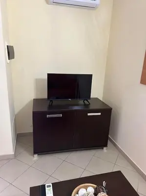 a tv on top of a dresser in a room at appartement by seb in Santa Maria