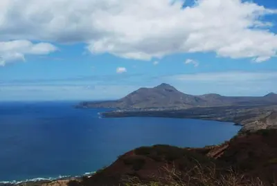 a view of a large body of water with a mountain at Self-catering Apartment w/ Terrace in Tarrafal