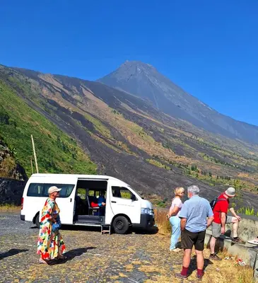 a group of people standing in front of a van at TCHAN LOVe in Portela