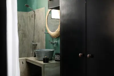 a bathroom with a sink and a shower at Casa Archipel - Lagedos in Ribeira Fria