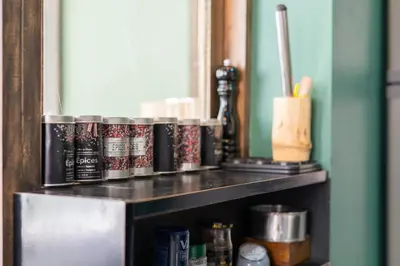 a shelf with a bunch ofbeer cans on it at Casa Archipel - Lagedos in Ribeira Fria