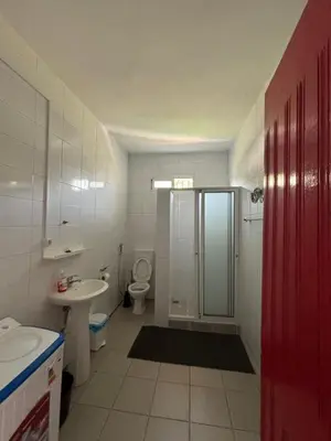 a bathroom with a shower and a toilet and a sink at Casa Cisalta N2 - 5mn Centro City in Praia