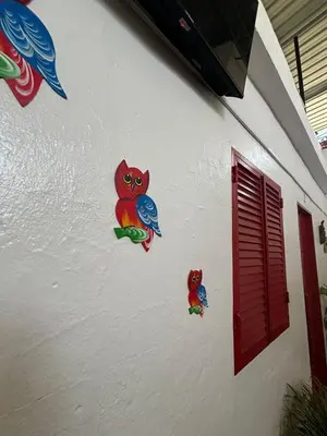 a wall with three stickers of an owl on it at Casa Cisalta N2 - 5mn Centro City in Praia