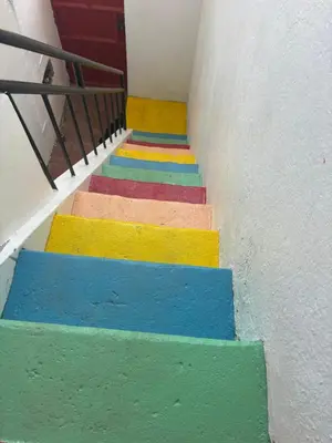 a set of colorful stairs with a door at Casa Cisalta N2 - 5mn Centro City in Praia