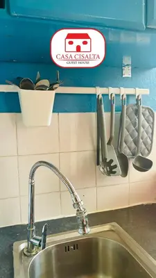a kitchen counter with a sink and a sink at Casa Cisalta N5 - Quarto Casal in Praia