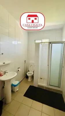 a bathroom with a toilet and a shower and a sink at Casa Cisalta N5 - Quarto Casal in Praia