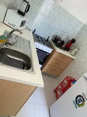 a kitchen with a sink and a counter top at Apartment 3 minutes from Nelson Mandela Airport in Praia