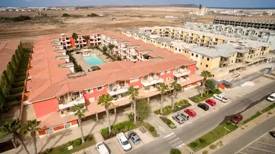 an overhead view of a building with a pool at Paraiso Tropical wifi and pool Djadsal moradias in Santa Maria