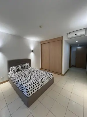 a bedroom with a bed and a closet in it at Soares Appart's in Santa Maria