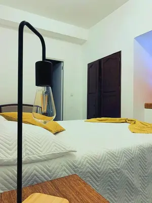 a bed with a glass lamp on top of it at Kasa Wahnon in Pombas