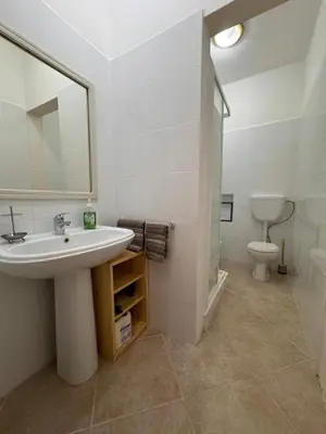 a bathroom with a sink and a toilet at Nautilus Cabral Sea view, free Wi-Fi in Sal Rei
