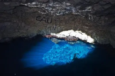 an aerial view of a cave with blue water at Tity Apartments T2 in Santa Maria