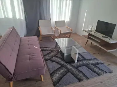 a living room with a couch and a coffee table at Brisa Mar Apartamento in Praia Baixo