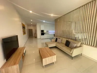 a living room with a couch and a coffee table at Apart JC Edificio Victor in Praia