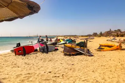 a group of kayaks on a sandy beach at Soleado 9 in Santa Maria
