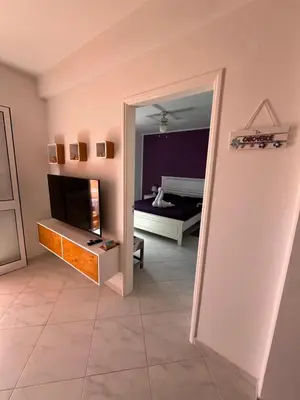 a room with a mirror and a room with a bed at Soleado 9 in Santa Maria