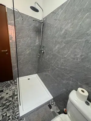 a bathroom with a shower and a toilet at Blue Ocean Escapes in Santa Maria