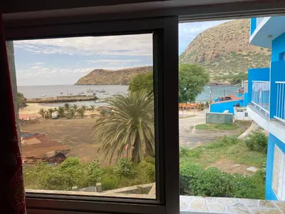 a view of the ocean from a window at Tarrafal Paradise Suite in Tarrafal