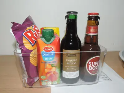a basket filled with beer and snacks on a counter at Hotel Halcyone - Ilha do Maio in Calheta Do Maio