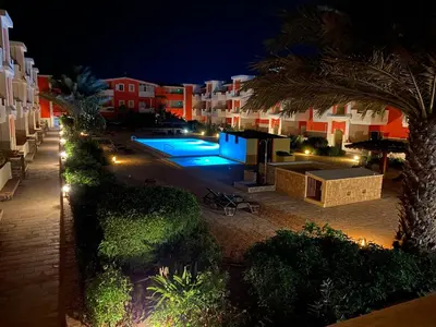 an aerial view of a swimming pool at night at African Lounge, Moradias Laranja in Prainha