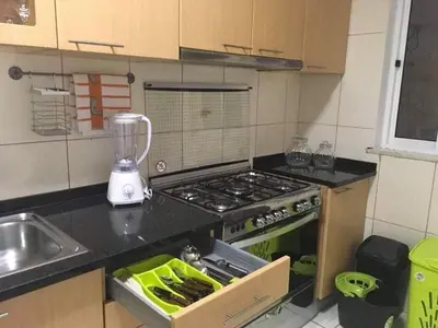 a kitchen with a stove and a counter top at Espaço 3M in Praia