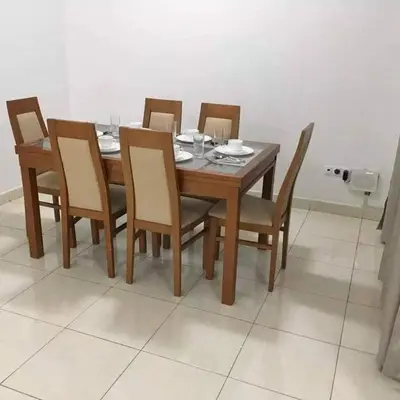 a dining room table with six chairs and a wooden table at Espaço 3M in Praia