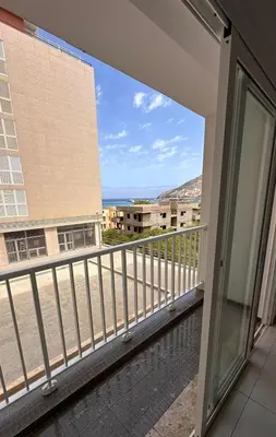 a balcony with a view of a building at Duarte Apartments - Império in Mindelo