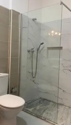 a bathroom with a shower with a toilet at KANDAKE APARTMENT II Sal Rei Wi-fi in Sal Rei