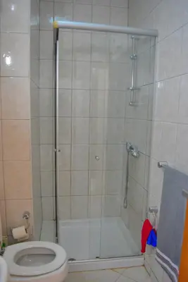 a bathroom with a shower and a toilet at Suíte Salinas - Vila Cabral 2 in Sal Rei