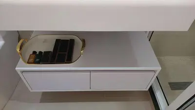a white cabinet with a box of cosmetics on it at Lily holiday hotel in Mindelo