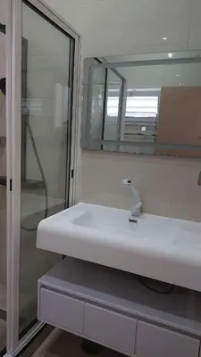 a bathroom with a white sink and a mirror at Lily holiday hotel in Mindelo
