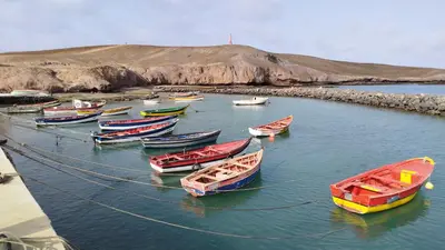 a group of boats are docked in the water at Onda do Mar in Santa Maria