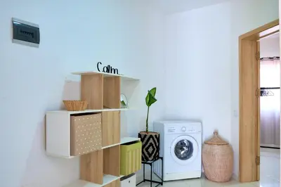 a laundry room with a washer and dryer at Super Cozy One-Bedroom Apartment in Santa Maria