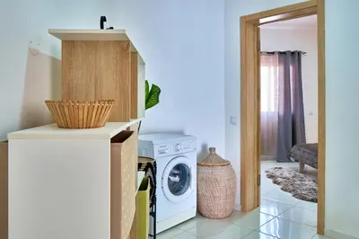 a laundry room with a washer and dryer at Super Cozy One-Bedroom Apartment in Santa Maria
