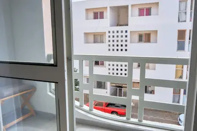 a view from a window of a building with a red car at Super Cozy One-Bedroom Apartment in Santa Maria