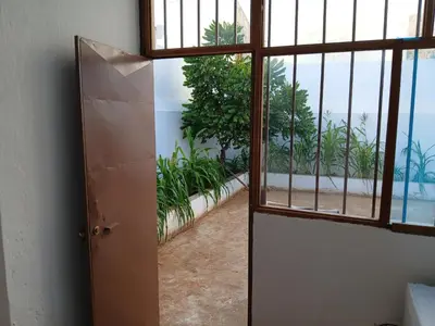 an open door to a room with a view of the ocean at Mille Nuits Appartement in Tarrafal