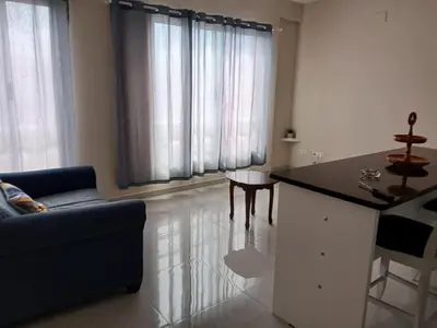 a living room with a couch and a table at Cozy Maia in Mindelo