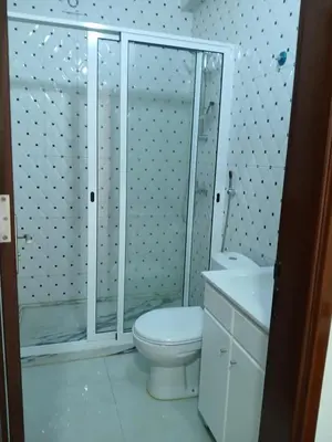 a bathroom with a toilet and a shower and a sink at Cozy Maia in Mindelo