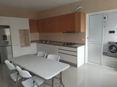 a kitchen with a white table and white chairs at Assomada Comfort Ap in Assomada