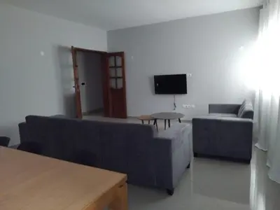 a living room with two couches and a tv at Assomada Comfort Ap in Assomada