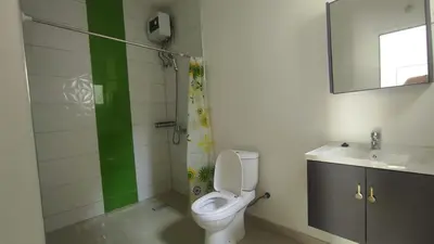 a bathroom with a toilet and a sink at Cafofo in Tarrafal