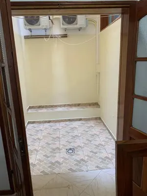 an empty room with two air conditioners on the wall at Two Bedroom Condo, Mindelo in Mindelo