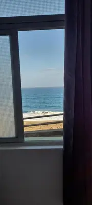 a window with a view of the ocean at Santos Medina in Ribeira Grande