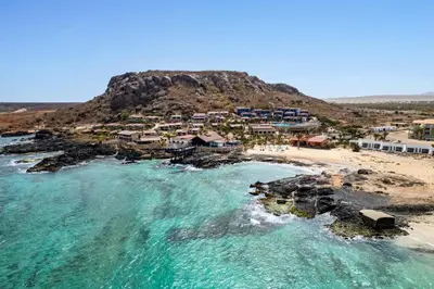 an aerial view of a beach with houses on a hill at Barceló Marine Boa Vista - Adults Only in Sal Rei