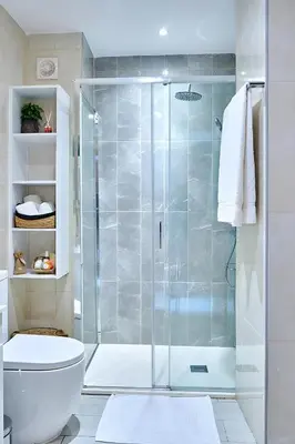 a bathroom with a shower and a toilet at Apartamento Ap3 T1 Santa Maria Residence in Santa Maria