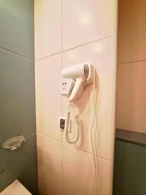 a telephone hanging on a wall in a bathroom at 2Bed-Vila-Verde Sal Cape Verde-Balcony-Pool in Santa Maria