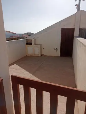 a view of a balcony with a door on a building at Holiday Maio in Calheta Do Maio